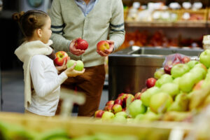 Man and child shopping for groceries
