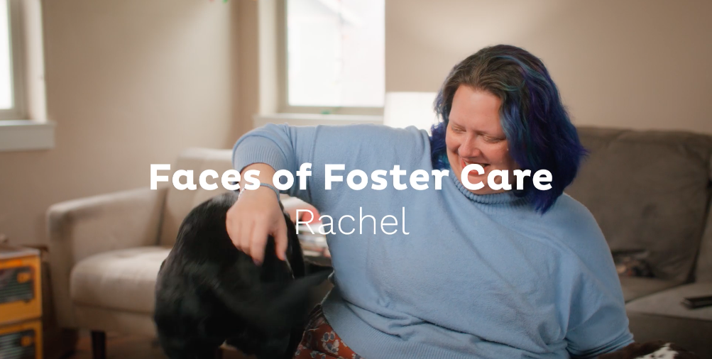 A picture of Rachel from her testimonial video, where she's playing with her dog